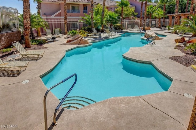 10525 Pine Glen Ave Unit 206, Las Vegas, NV 89144 - community pool with a patio and fence