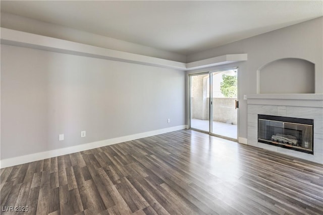 541 Indian Bluff St Unit 201, Las Vegas, NV 89145 - unfurnished living room with a fireplace, wood finished floors, and baseboards