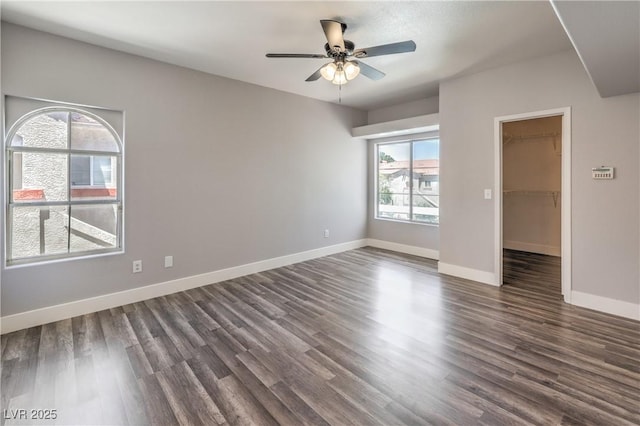 541 Indian Bluff St Unit 201, Las Vegas, NV 89145 - unfurnished room featuring dark wood-style flooring, a ceiling fan, and baseboards