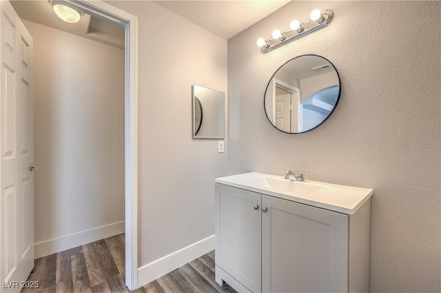 541 Indian Bluff St Unit 201, Las Vegas, NV 89145 - bathroom featuring wood finished floors, vanity, and baseboards