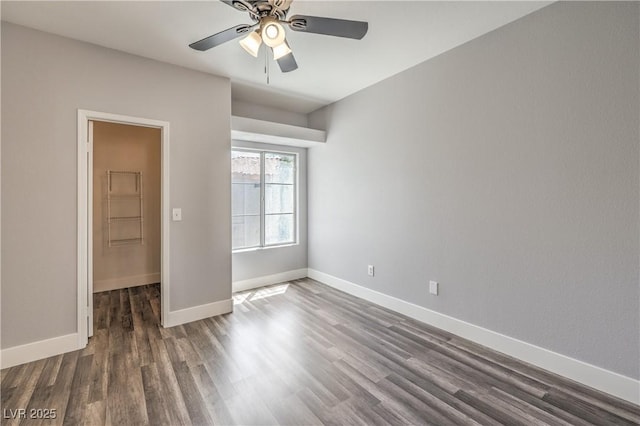 541 Indian Bluff St Unit 201, Las Vegas, NV 89145 - spare room featuring dark wood-style flooring, ceiling fan, and baseboards