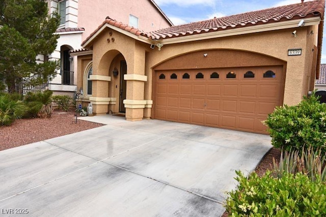 6339 Sharp Rock Ct, Las Vegas, NV 89139 - mediterranean / spanish-style home with stucco siding, driveway, a garage, and a tile roof