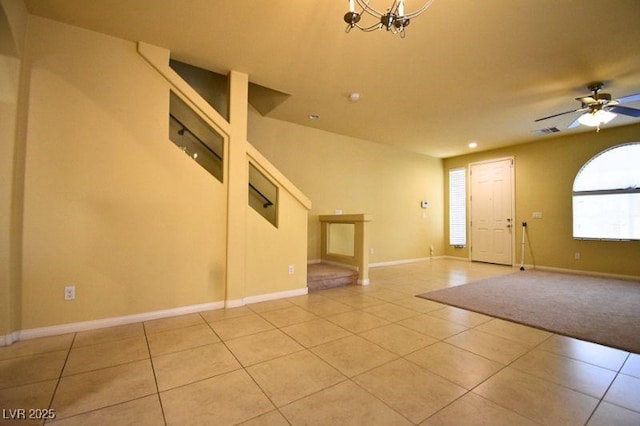6339 Sharp Rock Ct, Las Vegas, NV 89139 - empty room featuring light tile patterned floors, a chandelier, baseboards, and ceiling fan