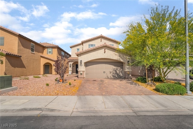 162 Sand Lake St, Henderson, NV 89074 - mediterranean / spanish-style house with decorative driveway, stucco siding, and a tile roof