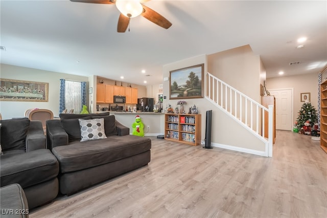 162 Sand Lake St, Henderson, NV 89074 - living area featuring stairs, a ceiling fan, light wood-type flooring, recessed lighting, and baseboards