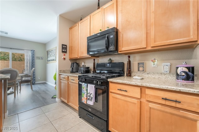 162 Sand Lake St, Henderson, NV 89074 - kitchen featuring black appliances, light brown cabinets, light stone counters, light tile patterned floors, and baseboards