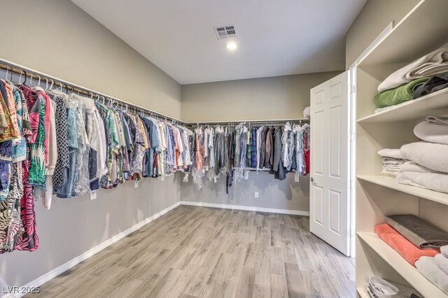 9760 Arch Canyon Ct, Las Vegas, NV 89149 - walk in closet featuring light wood-style flooring