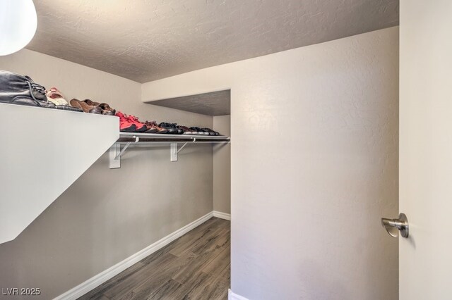 9760 Arch Canyon Ct, Las Vegas, NV 89149 - walk in closet featuring wood finished floors