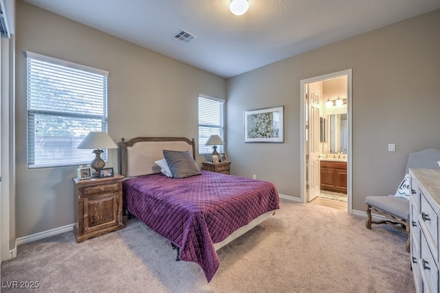9760 Arch Canyon Ct, Las Vegas, NV 89149 - bedroom with light carpet, baseboards, and connected bathroom