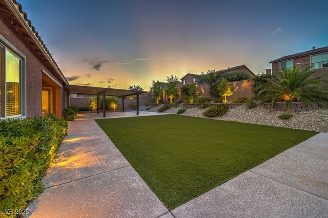9760 Arch Canyon Ct, Las Vegas, NV 89149 - yard at dusk with a patio
