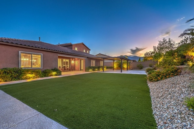 9760 Arch Canyon Ct, Las Vegas, NV 89149 - yard at dusk with a patio