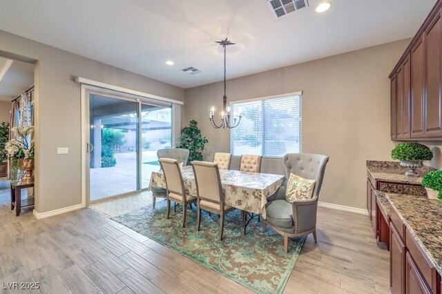 9760 Arch Canyon Ct, Las Vegas, NV 89149 - dining space with baseboards, light wood-type flooring, a chandelier, and recessed lighting