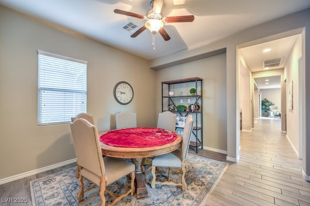 9760 Arch Canyon Ct, Las Vegas, NV 89149 - dining area featuring a ceiling fan, wood finished floors, and baseboards