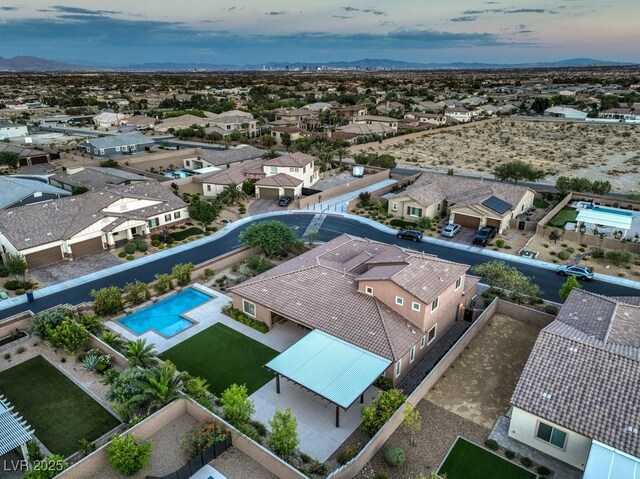 9760 Arch Canyon Ct, Las Vegas, NV 89149 - aerial view of residential area with a pool area and a mountainous background