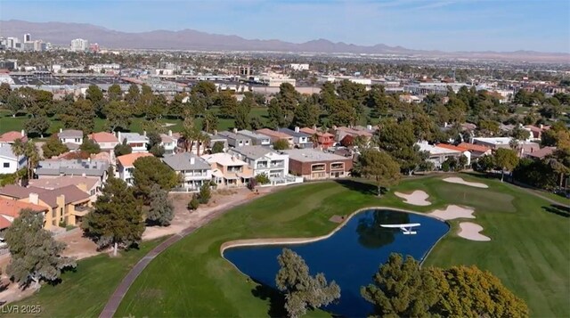 778 Vegas Valley Dr, Las Vegas, NV 89109 - aerial view of property and surrounding area featuring a water and mountain view, a golf course, and nearby suburban area
