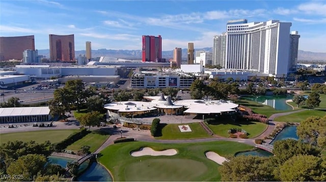 778 Vegas Valley Dr, Las Vegas, NV 89109 - aerial view of a golf course, a large body of water, and a skyline view