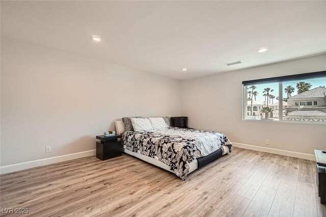 778 Vegas Valley Dr, Las Vegas, NV 89109 - bedroom with baseboards, wood finished floors, and recessed lighting