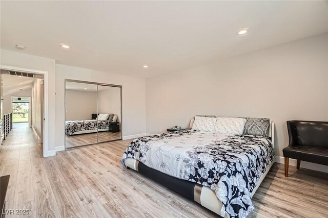 778 Vegas Valley Dr, Las Vegas, NV 89109 - bedroom featuring light wood-type flooring, a closet, recessed lighting, and baseboards