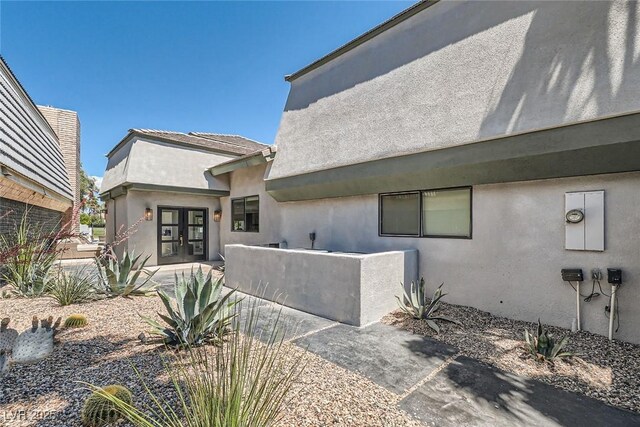 778 Vegas Valley Dr, Las Vegas, NV 89109 - view of home's exterior featuring french doors and stucco siding