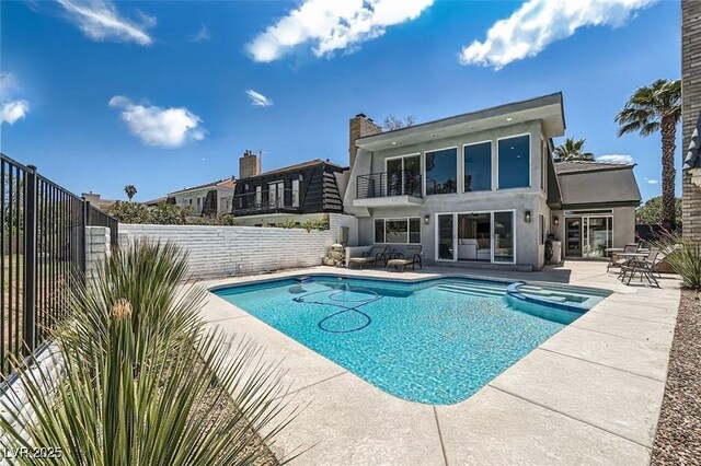 778 Vegas Valley Dr, Las Vegas, NV 89109 - view of swimming pool with a patio area, a fenced backyard, and a pool with connected hot tub
