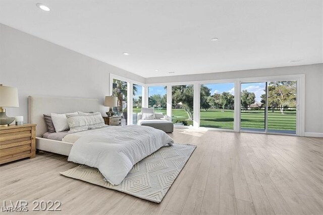 778 Vegas Valley Dr, Las Vegas, NV 89109 - bedroom with access to exterior, wood finished floors, and recessed lighting