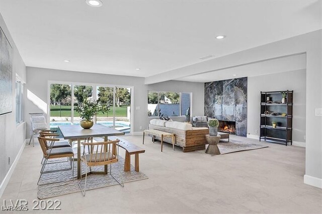 778 Vegas Valley Dr, Las Vegas, NV 89109 - dining room with baseboards, a fireplace, and recessed lighting