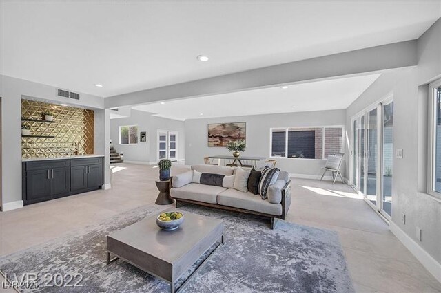 778 Vegas Valley Dr, Las Vegas, NV 89109 - living area featuring baseboards, stairway, a dry bar, and recessed lighting