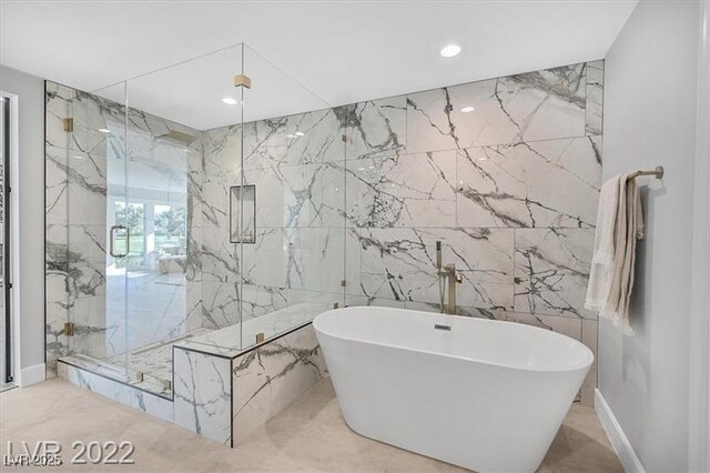 778 Vegas Valley Dr, Las Vegas, NV 89109 - full bathroom with tile walls, a soaking tub, a marble finish shower, marble tiled floors, and recessed lighting