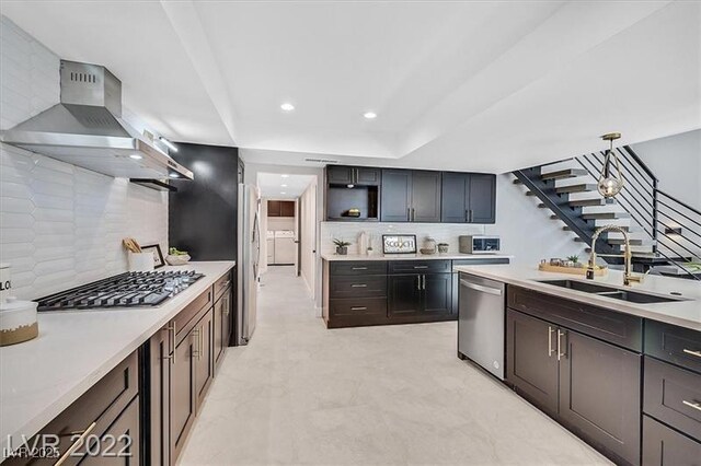 778 Vegas Valley Dr, Las Vegas, NV 89109 - kitchen featuring a sink, appliances with stainless steel finishes, open shelves, wall chimney range hood, and backsplash