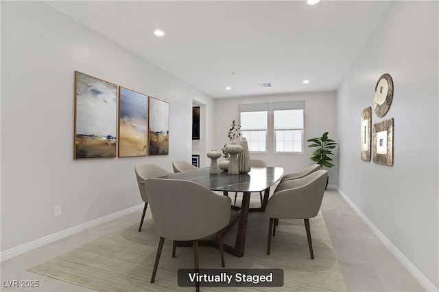 dining space featuring recessed lighting and baseboards