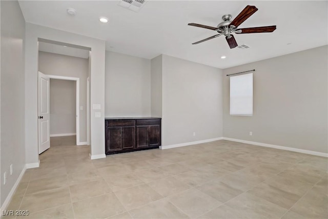 unfurnished room featuring a ceiling fan, recessed lighting, and baseboards