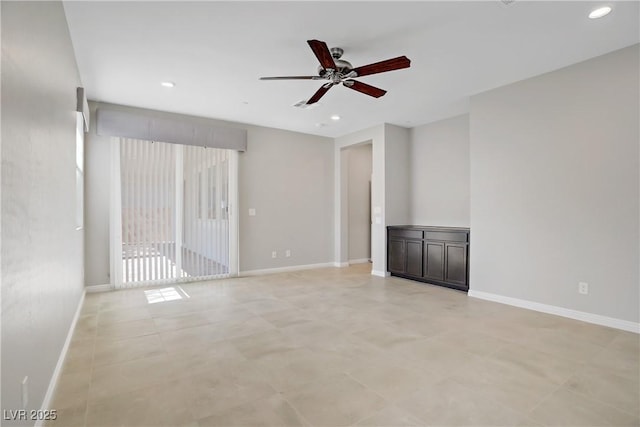 empty room with ceiling fan, baseboards, and recessed lighting
