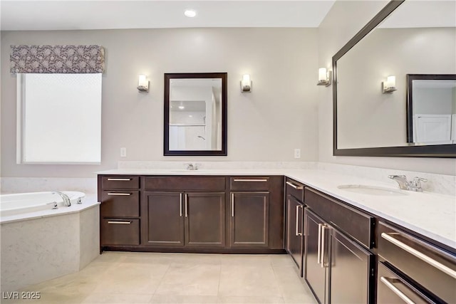 full bath with tile patterned floors, a bath, and double vanity