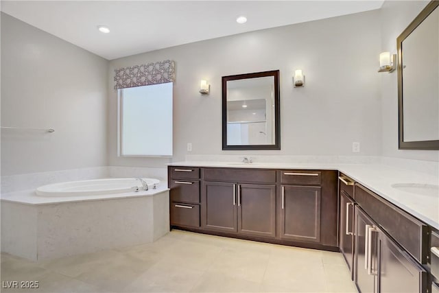 bathroom featuring a bath, vanity, and tile patterned floors