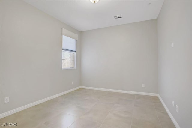 empty room with baseboards