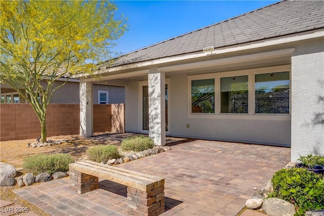 view of patio / terrace featuring fence