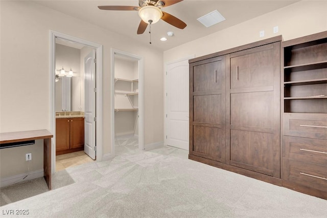 7668 Friendly Breeze Ct, Las Vegas, NV 89123 - unfurnished bedroom featuring light carpet, a sink, baseboards, connected bathroom, and recessed lighting