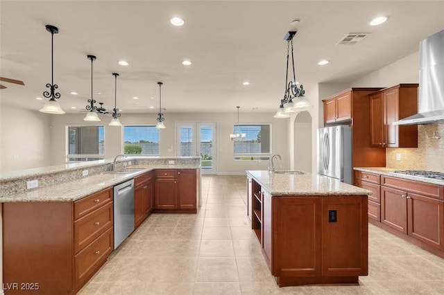 7668 Friendly Breeze Ct, Las Vegas, NV 89123 - kitchen featuring appliances with stainless steel finishes, a large island, wall chimney exhaust hood, a sink, and recessed lighting