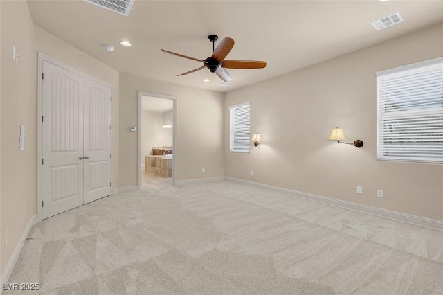 7668 Friendly Breeze Ct, Las Vegas, NV 89123 - unfurnished bedroom with light colored carpet, recessed lighting, baseboards, ensuite bath, and a ceiling fan