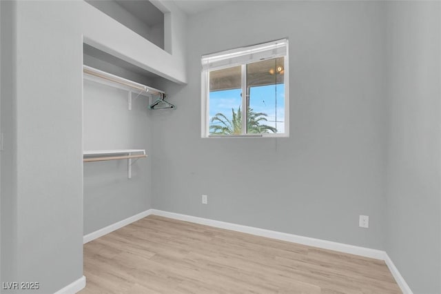 7668 Friendly Breeze Ct, Las Vegas, NV 89123 - walk in closet featuring wood finished floors