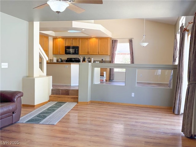 1564 Silver Knoll Ave, Las Vegas, NV 89123 - kitchen featuring black microwave, ceiling fan, light wood-type flooring, and baseboards