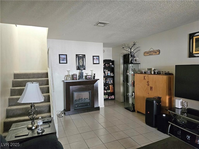 1128 Willow Tree Dr Unit C, Las Vegas, NV 89128 - living area featuring light tile patterned floors and a textured ceiling