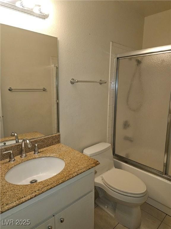 1128 Willow Tree Dr Unit C, Las Vegas, NV 89128 - full bath featuring vanity, tile patterned flooring, and bath / shower combo with glass door