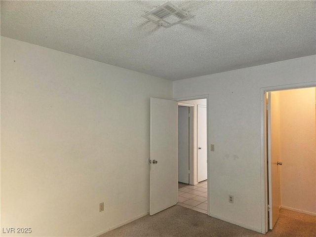1128 Willow Tree Dr Unit C, Las Vegas, NV 89128 - unfurnished bedroom with carpet floors and a textured ceiling