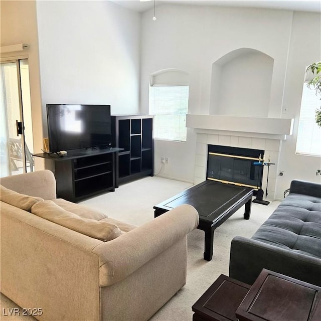 5415 W Harmon Ave Unit 2094, Las Vegas, NV 89103 - carpeted living area with plenty of natural light and a tile fireplace