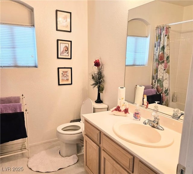 5415 W Harmon Ave Unit 2094, Las Vegas, NV 89103 - full bath featuring toilet, vanity, a shower with shower curtain, and baseboards