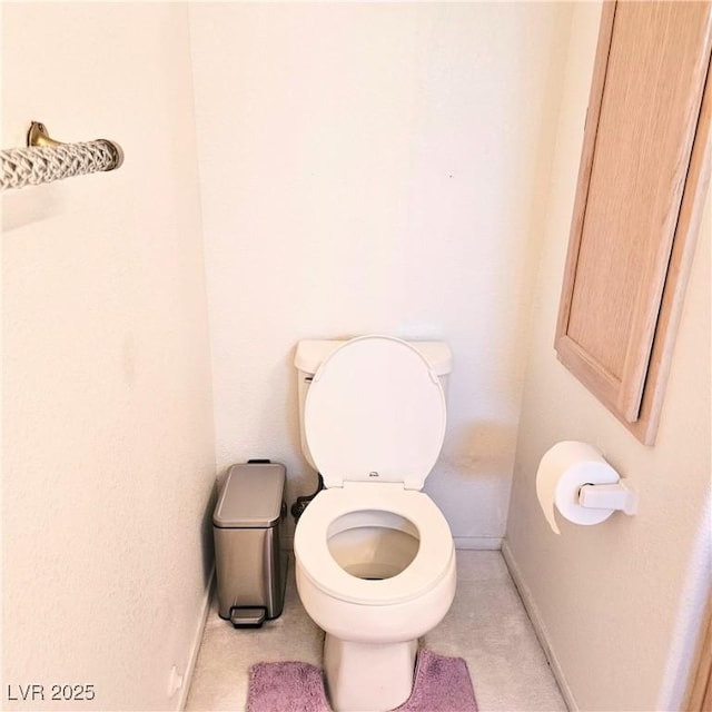 5415 W Harmon Ave Unit 2094, Las Vegas, NV 89103 - bathroom featuring baseboards and toilet