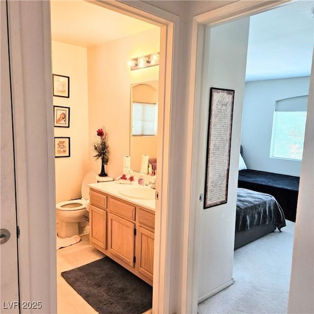 5415 W Harmon Ave Unit 2094, Las Vegas, NV 89103 - bathroom with connected bathroom, vanity, and toilet