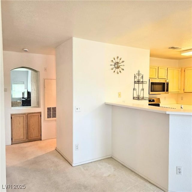 5415 W Harmon Ave Unit 2094, Las Vegas, NV 89103 - kitchen with appliances with stainless steel finishes, light colored carpet, and light countertops