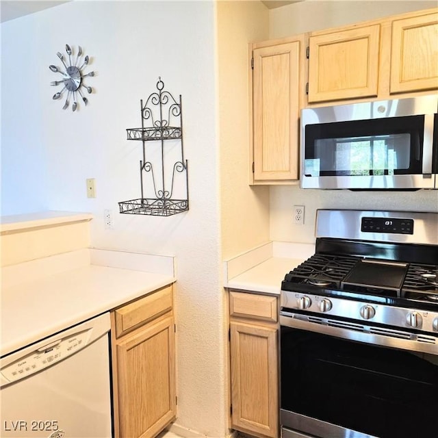 5415 W Harmon Ave Unit 2094, Las Vegas, NV 89103 - kitchen featuring stainless steel appliances, light brown cabinets, and light countertops